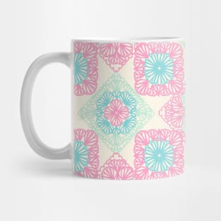 Pink and blue granny squares over cream Mug